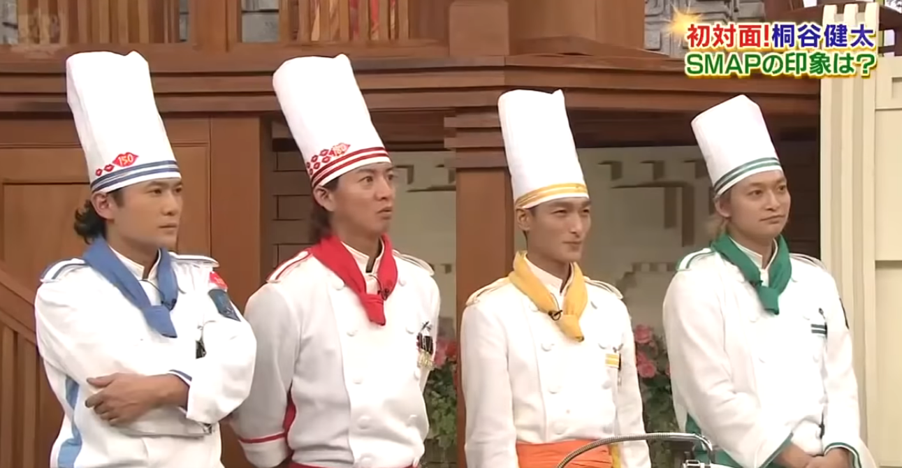 Image of four of the five members of SMAP as chefs, wearing white coats and chef toques